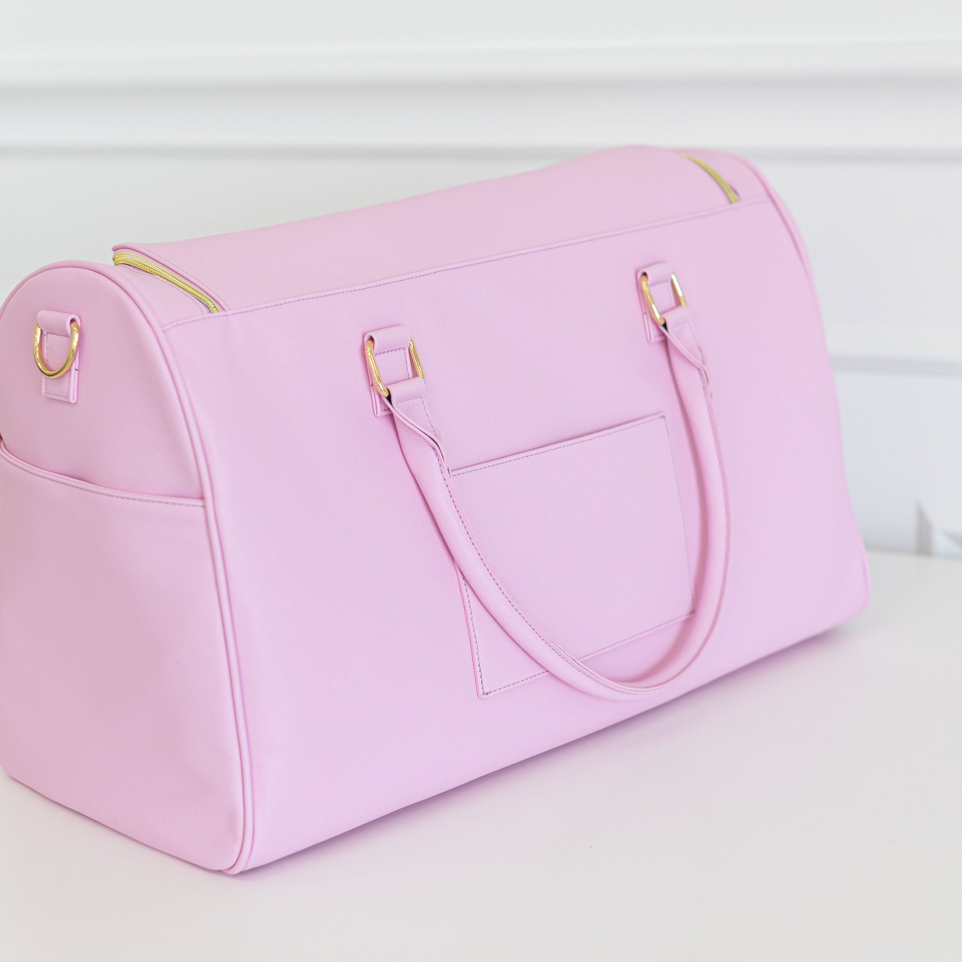 Pink leather duffle bag